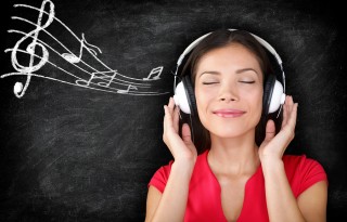 Music - woman wearing headphones listening to music with music n